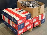 a stack of boxes on a pallet next to a wall