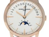 a close up of a wrist watch with a moon on it