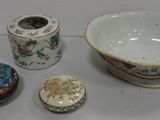 a bowl, a bowl, and a container sitting on a table