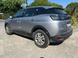 a grey car that is parked in the parking lot