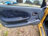 a picture of a car door with the door handle missing
