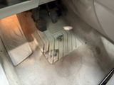 a car that has a floor mat in the front of it