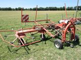 a tractor with a plow attached to it in a field