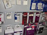 many cell phones on the wall in the store
