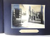 a black and white photo of people walking down a hallway