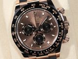 rolex watch with black dial and rose gold bezel