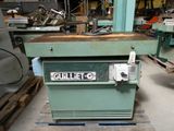 a machine that is sitting on a pallet in a warehouse