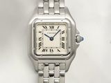 a close up of a wrist watch with roman numerals on it