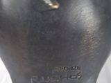 a close up of a bronze sculpture of a woman ' s head