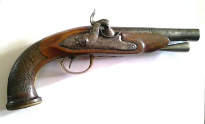 an old gun that is sitting on top of a table