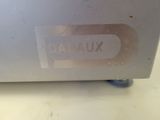 a close up of a metal box with a sticker on it