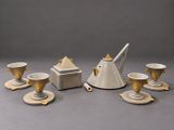 an image of a tea set with cups and saucers on a table
