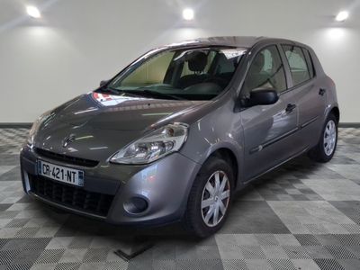 a picture of a grey car parked in a garage