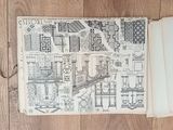a drawing of a map on a book on the floor