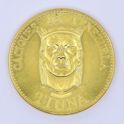an image of a gold coin with a man ' s face on it