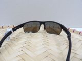 sunglasses on a woven basket on a table with a white background