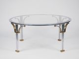 une table basse en verre et en laiton avec un plateau circulaire en verre