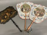 three different types of hand fans on the table