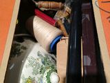a box with a bunch of sewing supplies inside of it