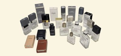 many different types of perfumes on the table