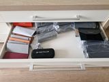 a drawer that has a lot of items in it