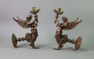 pair of antique bronze figurines of a winged woman and a man