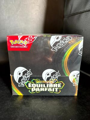 a close up of a box of pokemon trading cards on a table