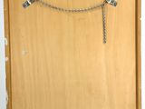 a picture of a wooden box with a chain attached to it