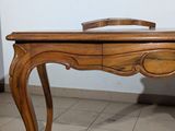 a wooden table with a mirror on top of it