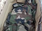 a cardboard box filled with clothes and a blanket