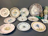 many plates and vases that are on the table
