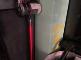 a vacuum that is sitting on the floor next to a bag