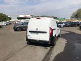 a white van that is parked in a parking lot