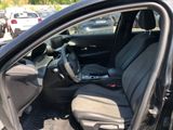 the interior of a car with the door open showing the driver ' s seat