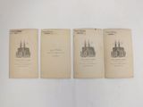 three old books with drawings of buildings on them sitting on a table