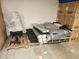 a room with a lot of boxes and pallets on the floor