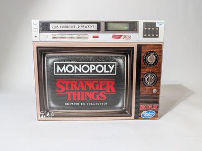 a small television set with the words stranger things on it