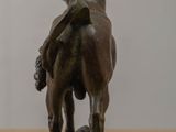 a statue of a bull and a cow on a table