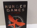 a book with a red bird on it sitting on top of a table