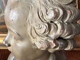 a statue of a woman that is sitting on a table