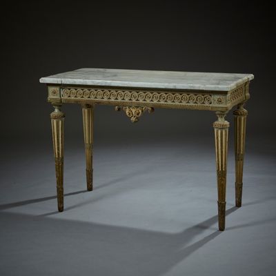 an image of a table with a marble top and gold legs