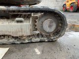 an image of a close up of a construction vehicle ' s tire