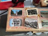 a table with a bunch of old photos on it