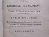 an old book with black writing on it sitting on top of a table
