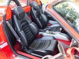 an image of a red car with black leather seats