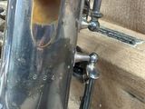 a metal pipe that is sitting on the side of a building