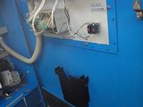 a blue machine that is sitting in a room