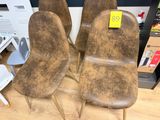 three brown chairs with a price tag on them sitting on a wooden floor