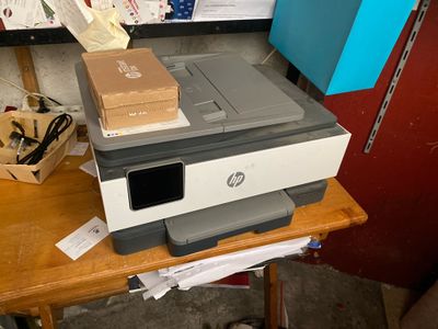 a printer that is sitting on top of a table