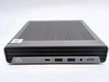 the back view of a laptop computer sitting on top of a white surface